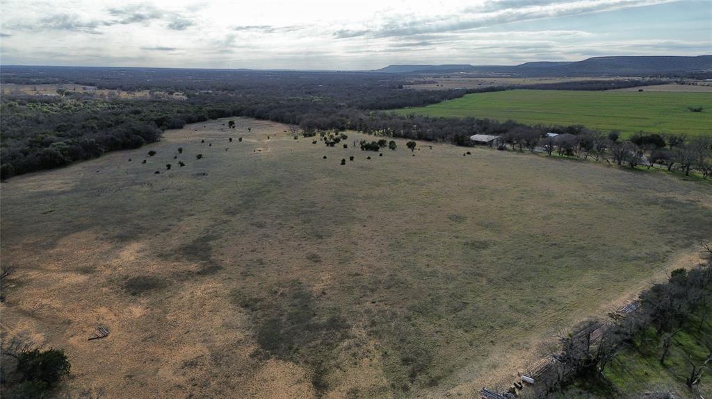 Lot 135 River Canyon Road Palo Pinto, TX 76484 - Photo 11 of 17 a view of a dry yard with wooden fence