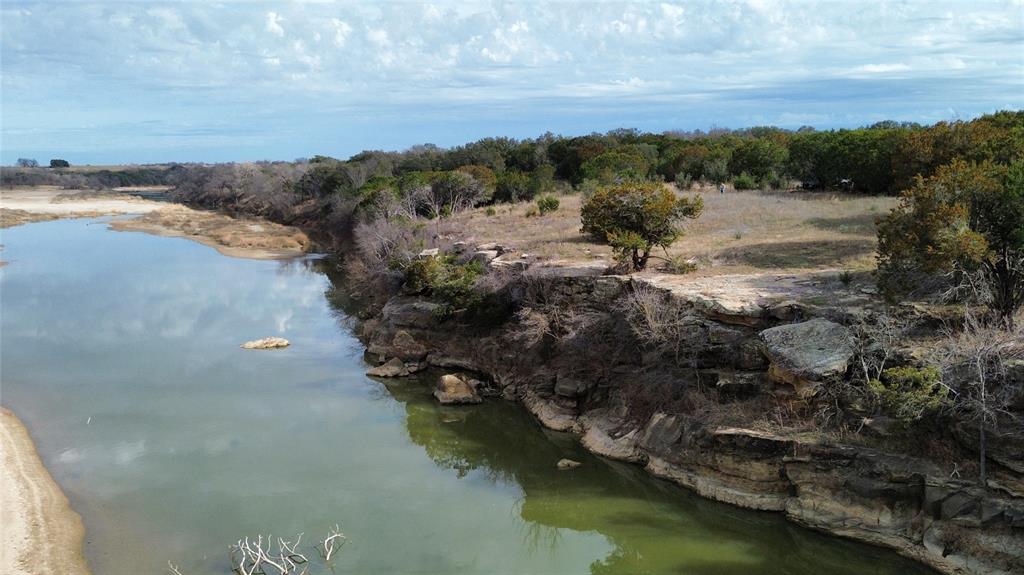 Lot 135 River Canyon Road Palo Pinto, TX 76484 - Photo 15 of 17 a view of a lake with mountain in background