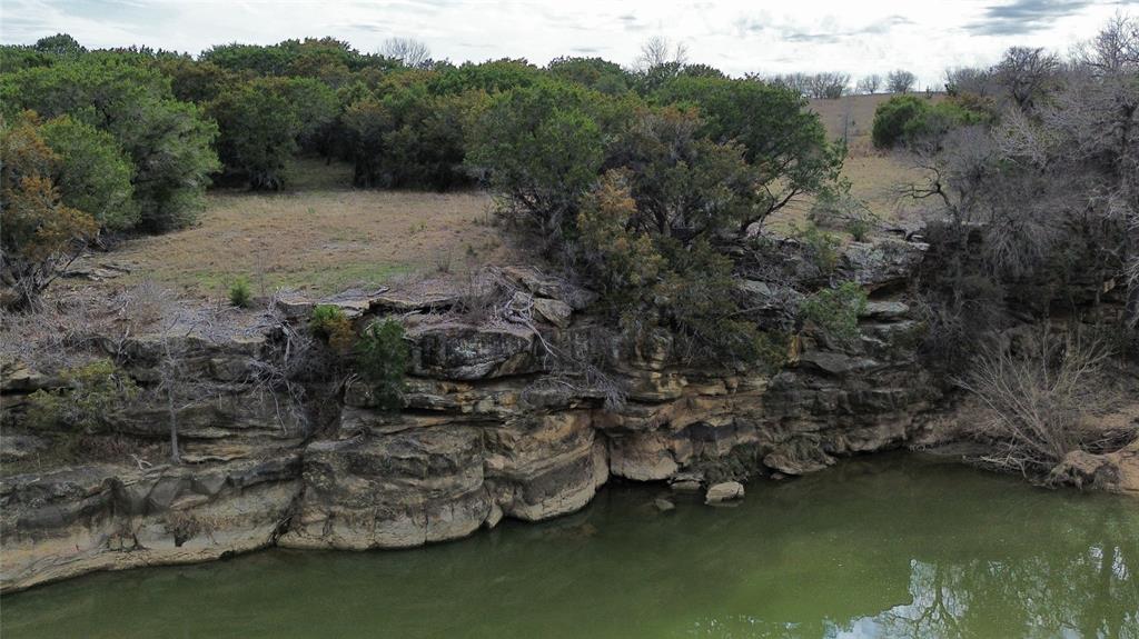 Lot 135 River Canyon Road Palo Pinto, TX 76484 - Photo 17 of 17 aerial view of a house with a yard