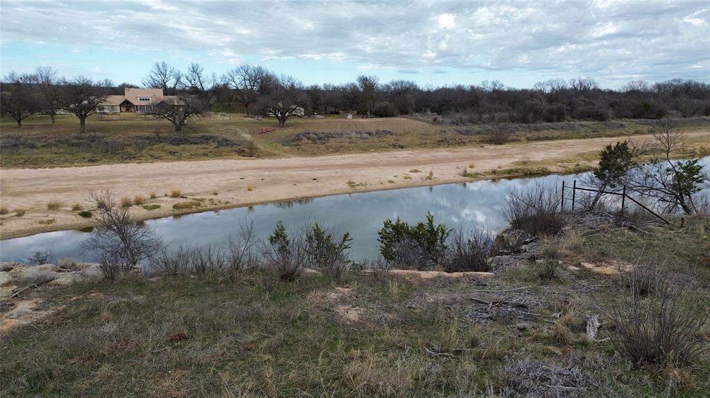 Lot 135 River Canyon Road Palo Pinto, TX 76484 - Photo 5 of 17 a view of a lake with beach and outdoor space