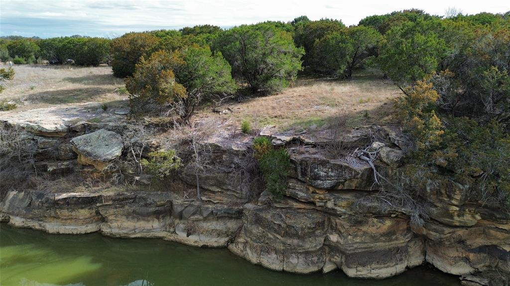 Lot 135 River Canyon Road Palo Pinto, TX 76484 - Photo 6 of 17 a view of a lake with mountain