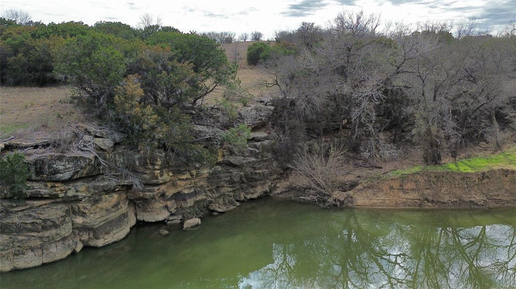 Lot 135 River Canyon Road Palo Pinto, TX 76484 - Photo 7 of 17 a view of a lake with mountain in the background