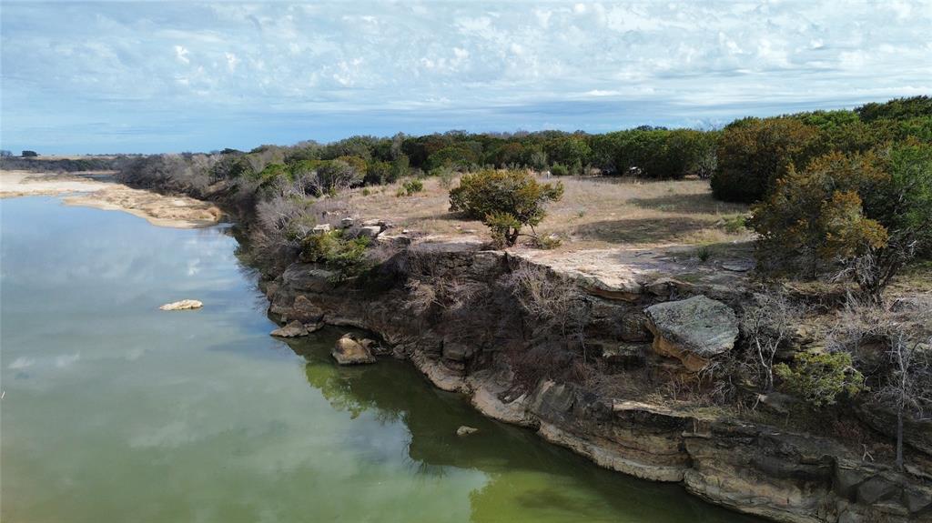 Lot 135 River Canyon Road Palo Pinto, TX 76484 - Photo 8 of 17 a view of a lake with mountains in the background