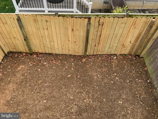 a view of a wooden fence