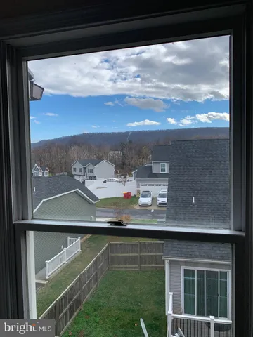 a white toilet sitting next to a bath tub and a shower