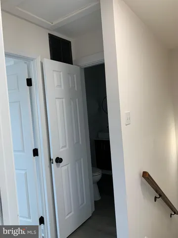 a view of an entryway with wooden floor