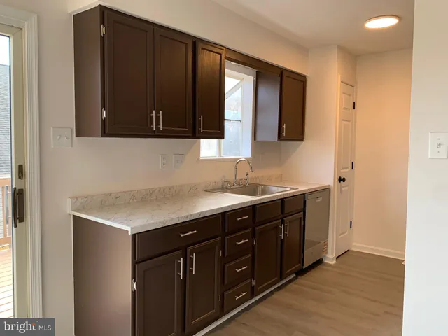 a kitchen with a sink and a cabinets