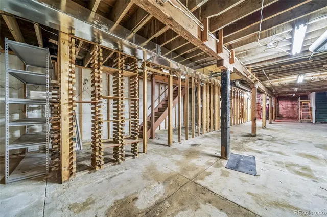 a view of water heater room with stairs