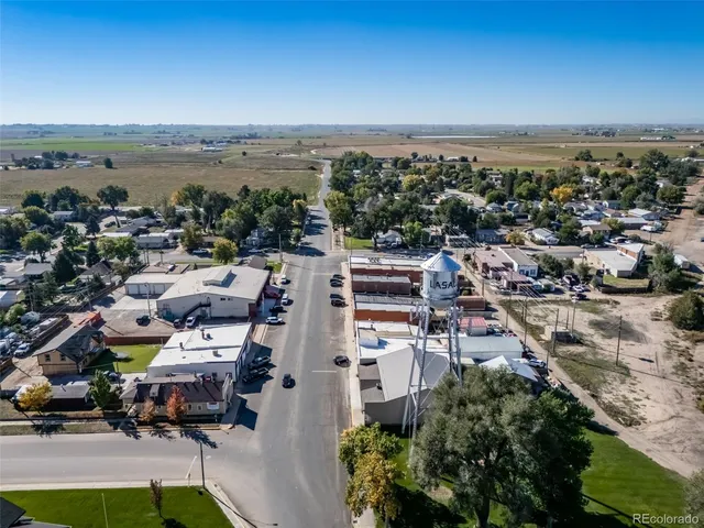an aerial view of a residential houses with outdoor space