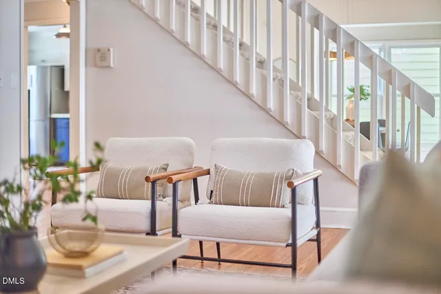 a living room with furniture and a table