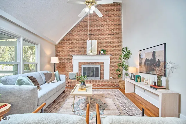 a living room with furniture and a fireplace