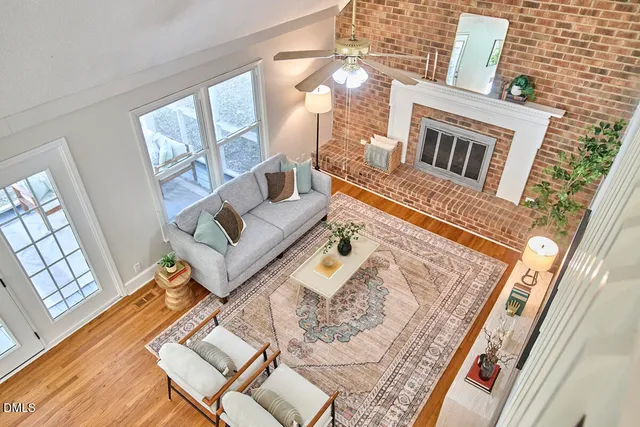 a living room with furniture and a rug