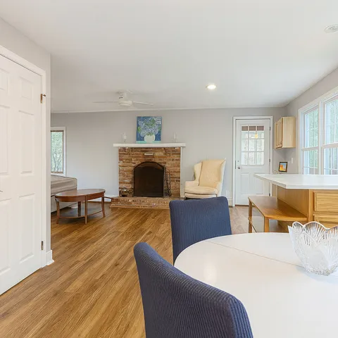 a bedroom with furniture and a fireplace