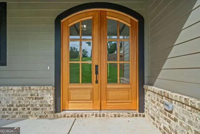 a front view of a house with a glass door