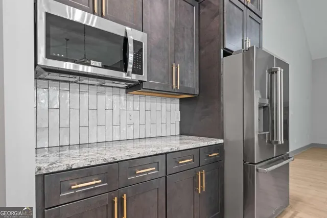 a view of a porch with a floor to ceiling window next to a yard