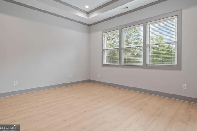 a bathroom with a granite countertop toilet sink and mirror