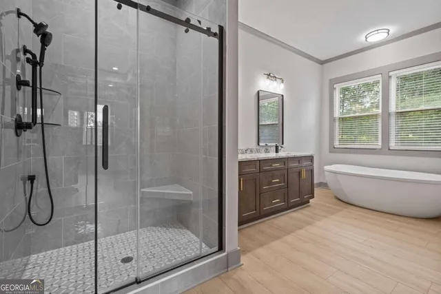 an empty room with ceiling fan and window
