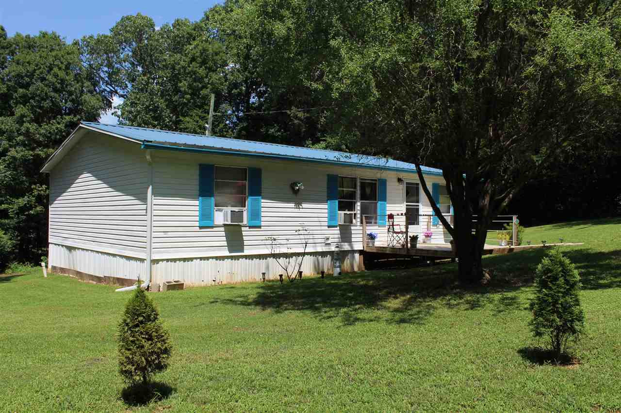 138 Murphy Tower Road Cedar Grove, TN 38321 - Photo 1 of 1 a front view of a house with a yard