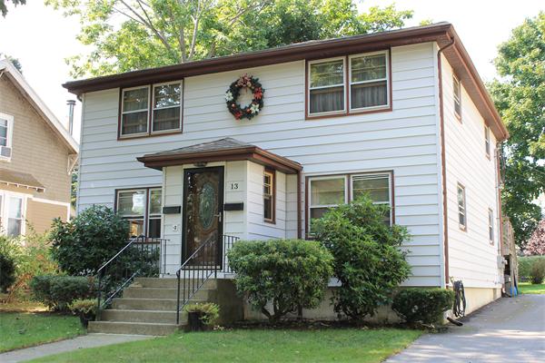 13 Woodman Road Worcester, MA 01602 - Photo 1 of 21 a front view of a house with a yard