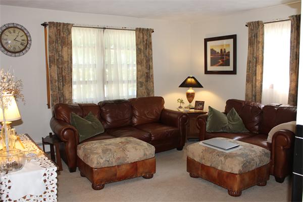 13 Woodman Road Worcester, MA 01602 - Photo 7 of 21 a living room with furniture a bed and a window