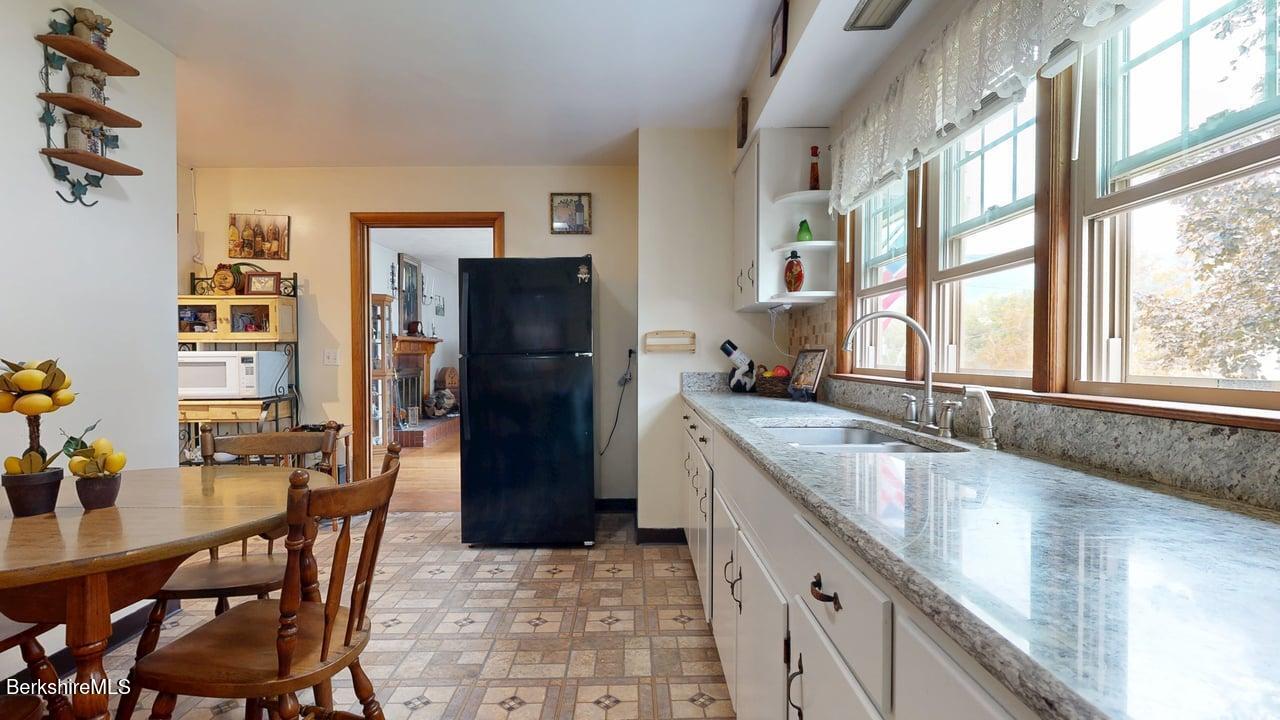 16 Anthony Street Adams, MA 01220 - Photo 11 of 33 a kitchen with a table and chairs