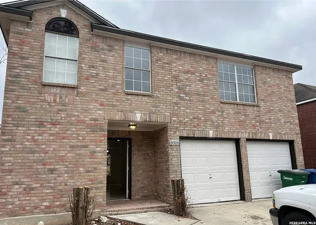 a front view of a house with parking space