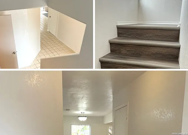 a view of staircase with white walls and railing