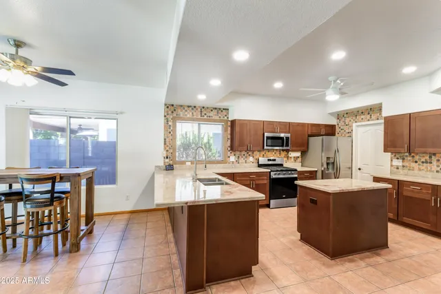 a kitchen with lots of counter top space and appliances