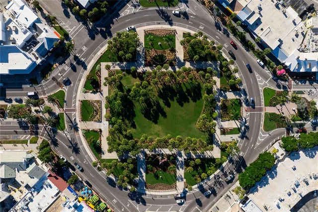 an aerial view of multiple houses with yard