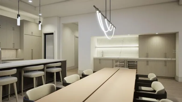 a hallway with a couch and chandelier