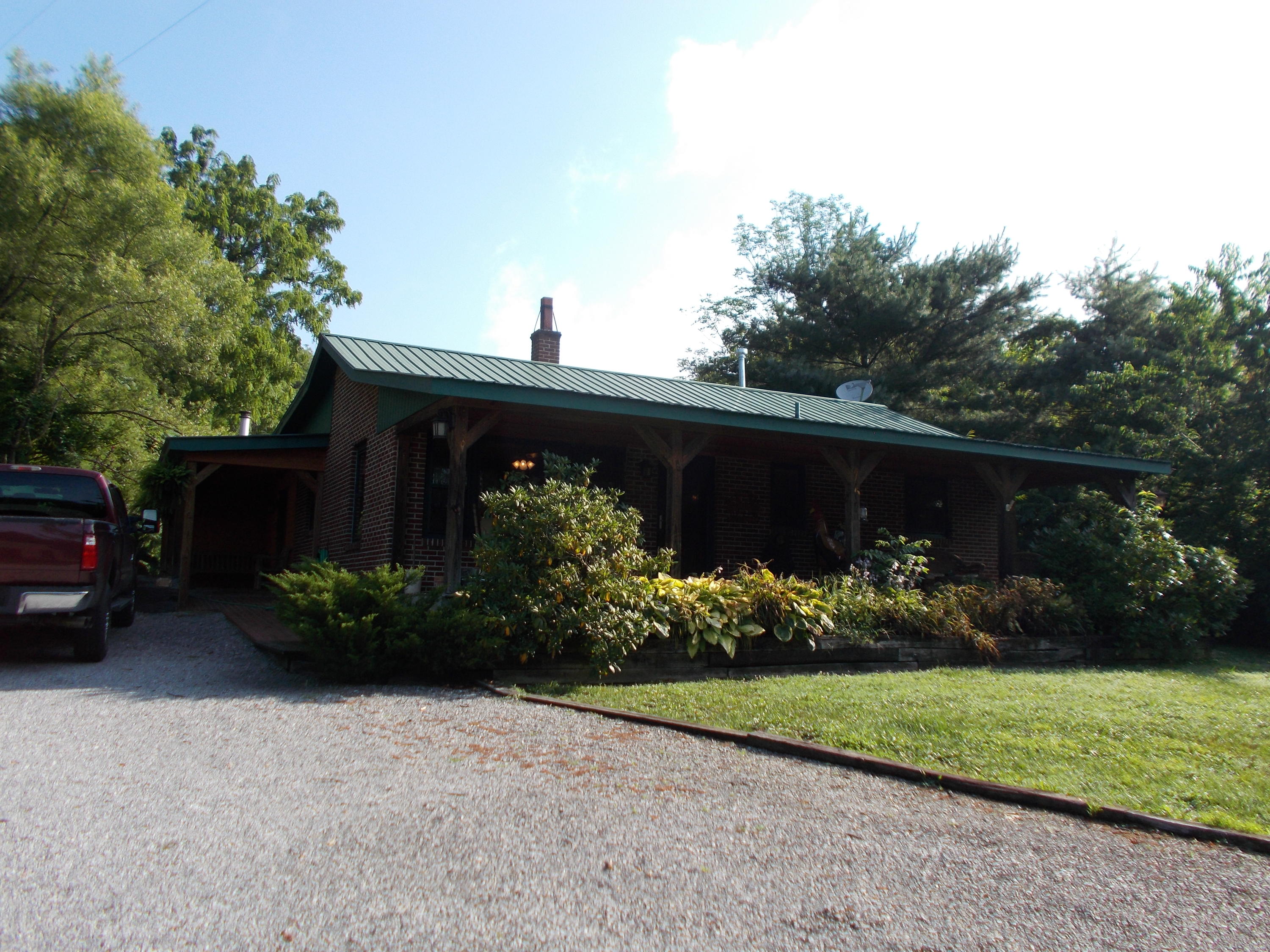 3741 Flatwoods Road Elliston, VA 24087 - Photo 1 of 51 a front view of a house with a yard