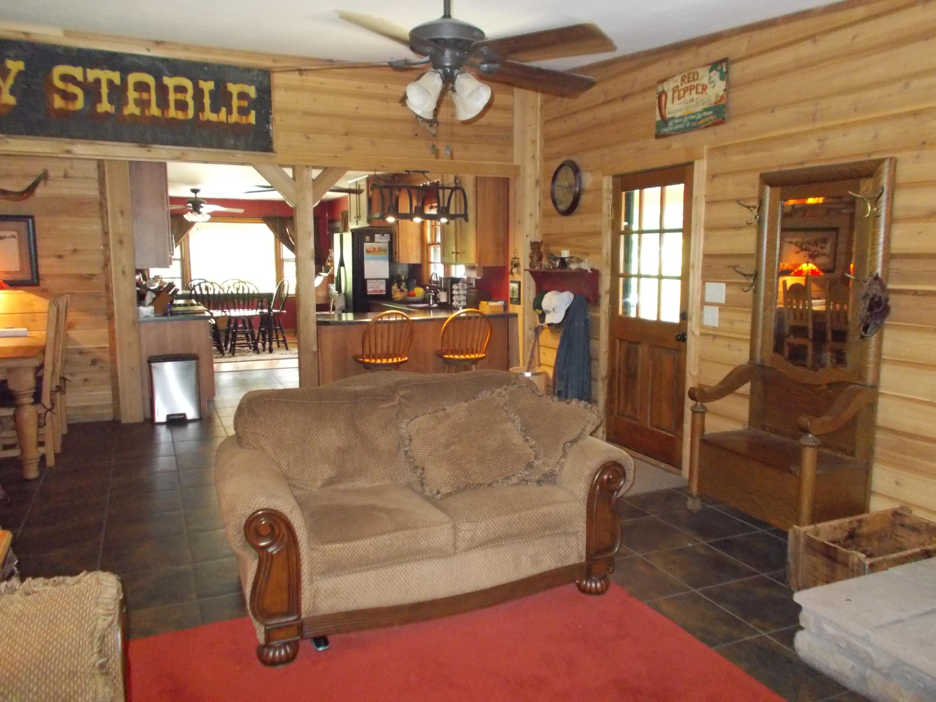 3741 Flatwoods Road Elliston, VA 24087 - Photo 14 of 51 a dining hall with couches and wooden floor