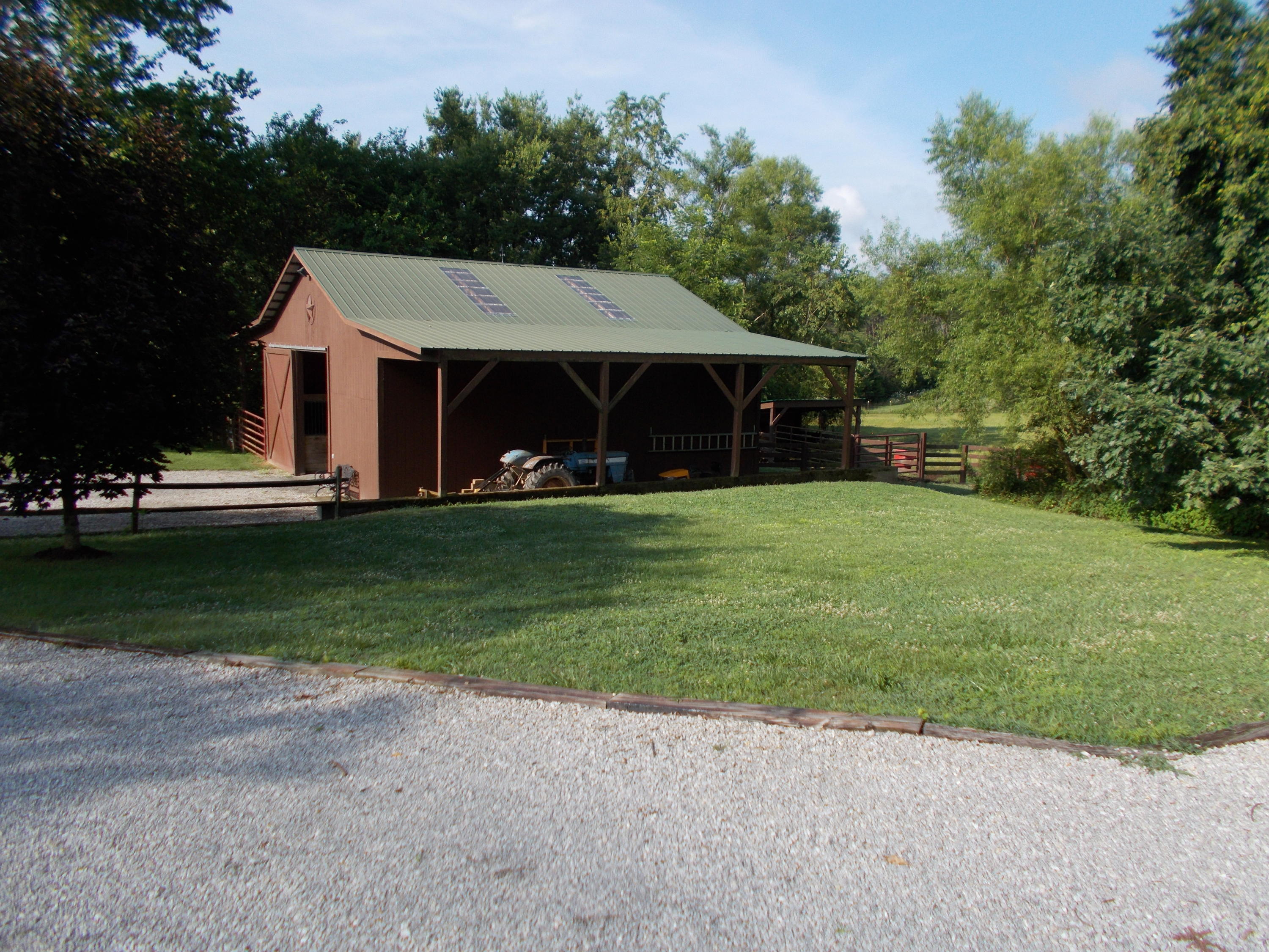 3741 Flatwoods Road Elliston, VA 24087 - Photo 31 of 51 a view of a house with a yard and sitting area