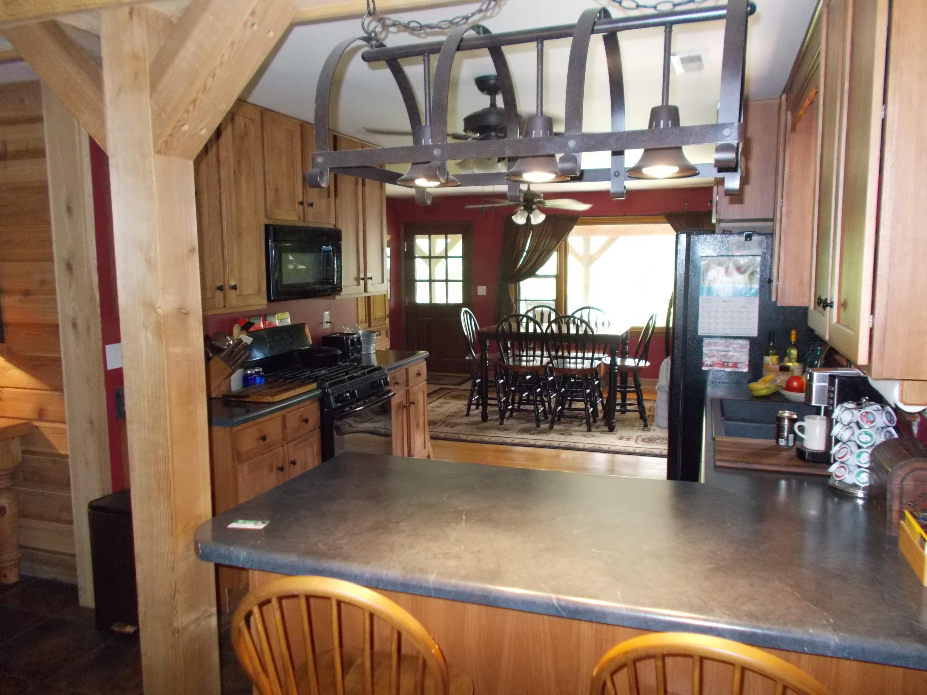3741 Flatwoods Road Elliston, VA 24087 - Photo 38 of 51 a view of a living room and a kitchen
