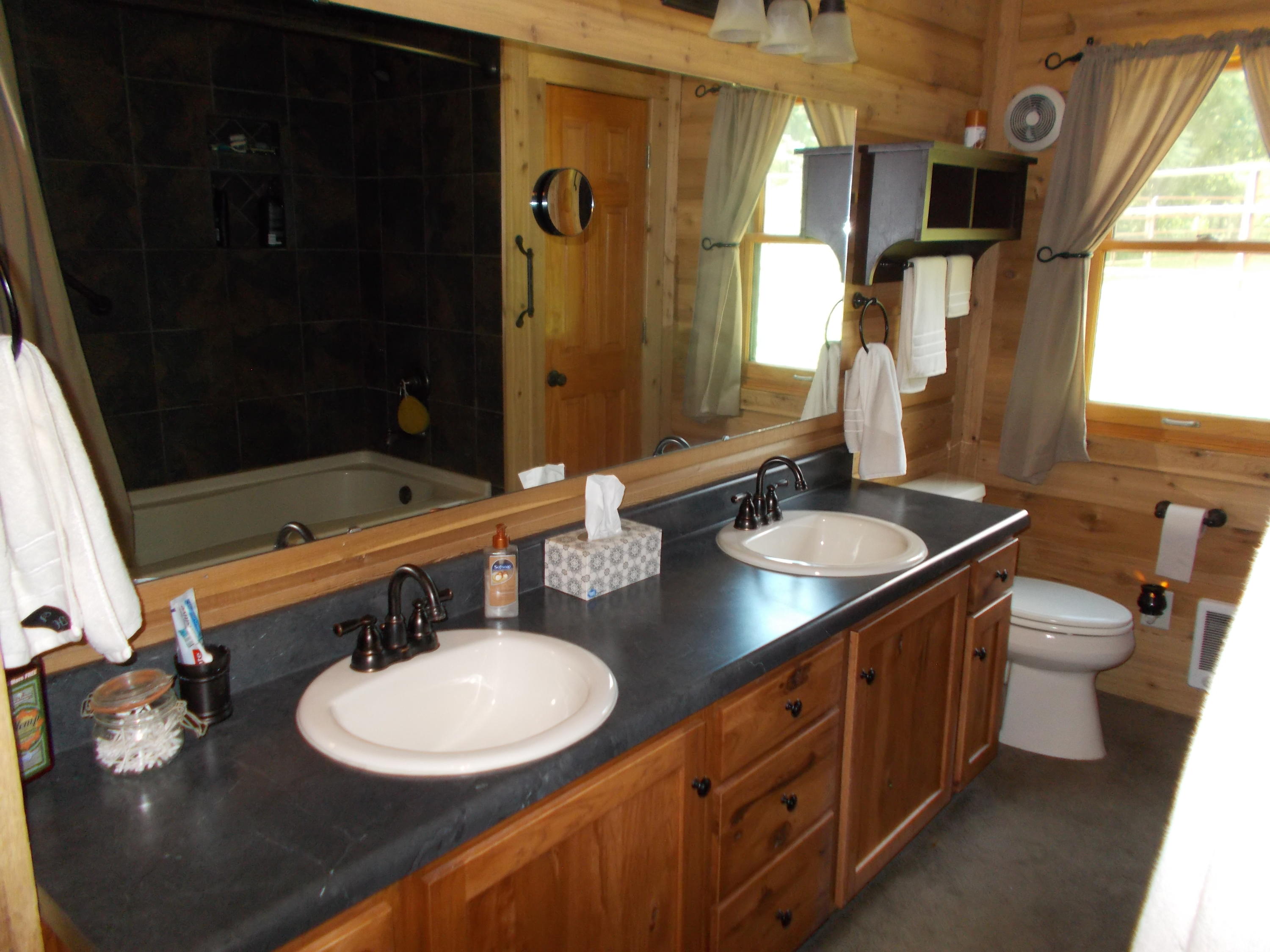 3741 Flatwoods Road Elliston, VA 24087 - Photo 40 of 51 a bathroom with a double vanity sink and a mirror