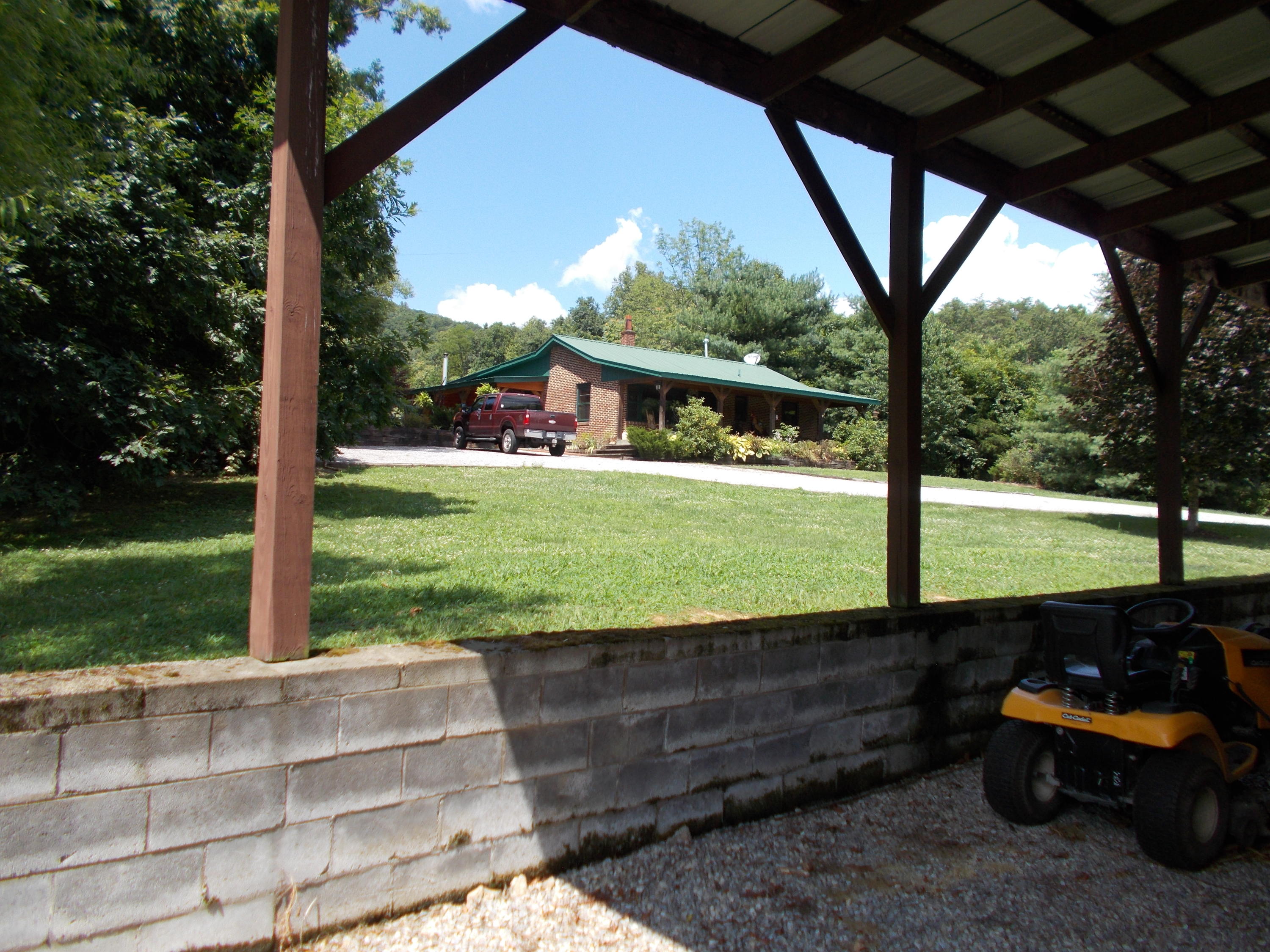 3741 Flatwoods Road Elliston, VA 24087 - Photo 48 of 51 a view of a porch with furniture and garden