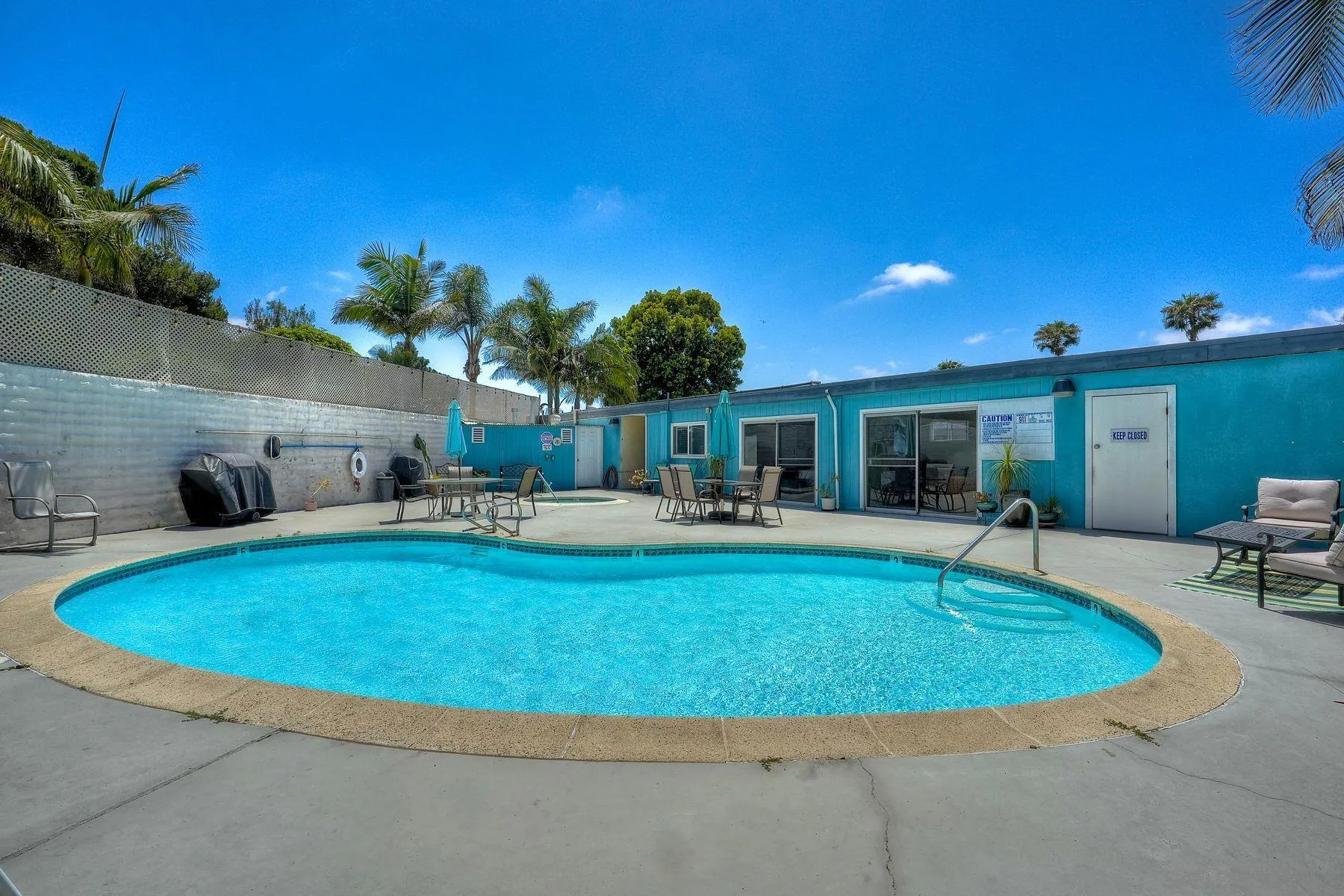 3606 Vista Rey, Unit 46 Oceanside, CA 92057 - Photo 28 of 36 a swimming pool with outdoor seating and yard