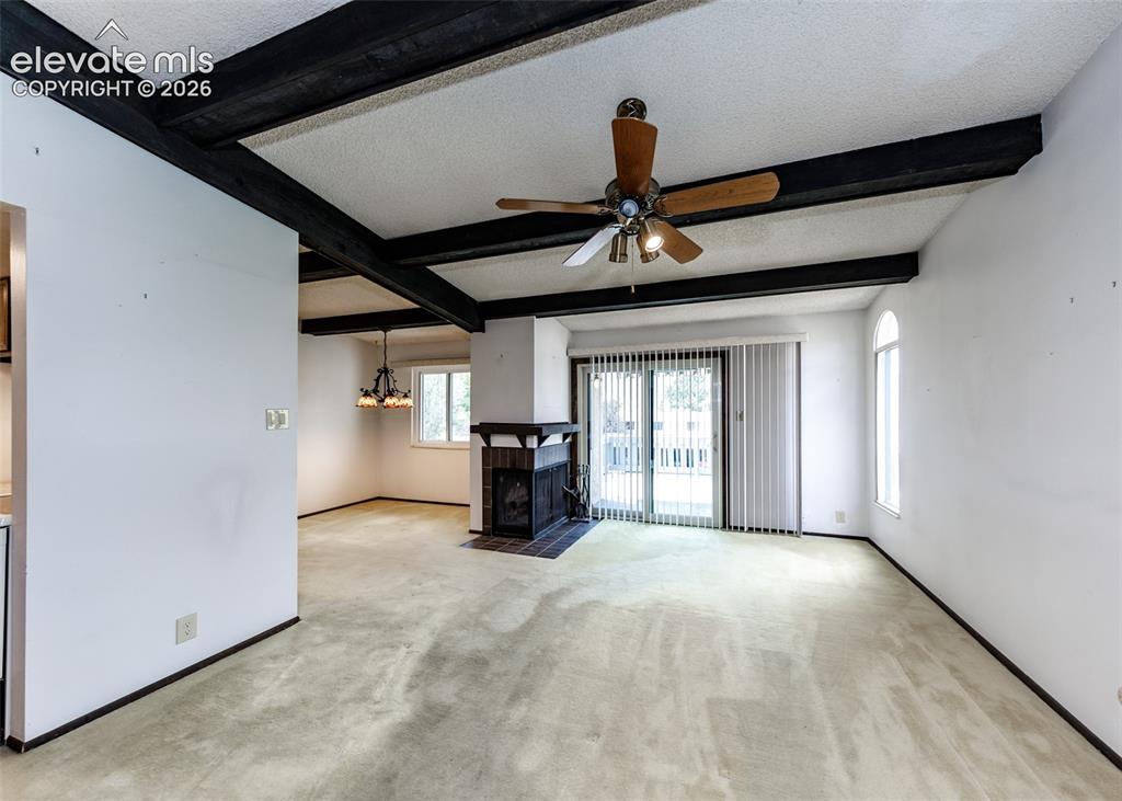 1034 Fontmore Road, Unit D Colorado Springs, CO 80904 - Photo 10 of 43 a view of a livingroom with a furniture hardwood and a ceiling fan