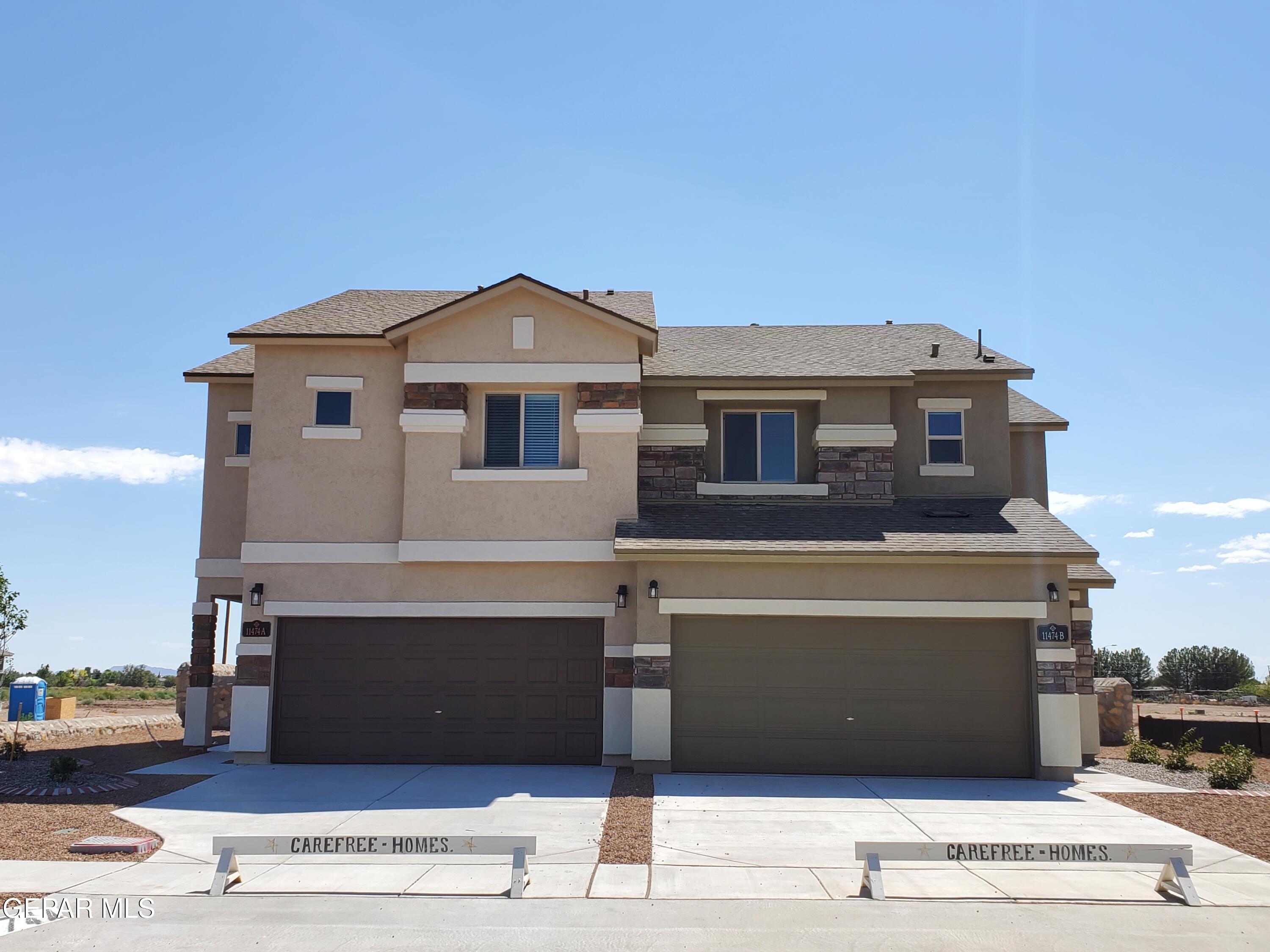 11474 Dawn Vw Road, Unit B Socorro, TX 79927 - Photo 1 of 1 a front view of a house with a balcony