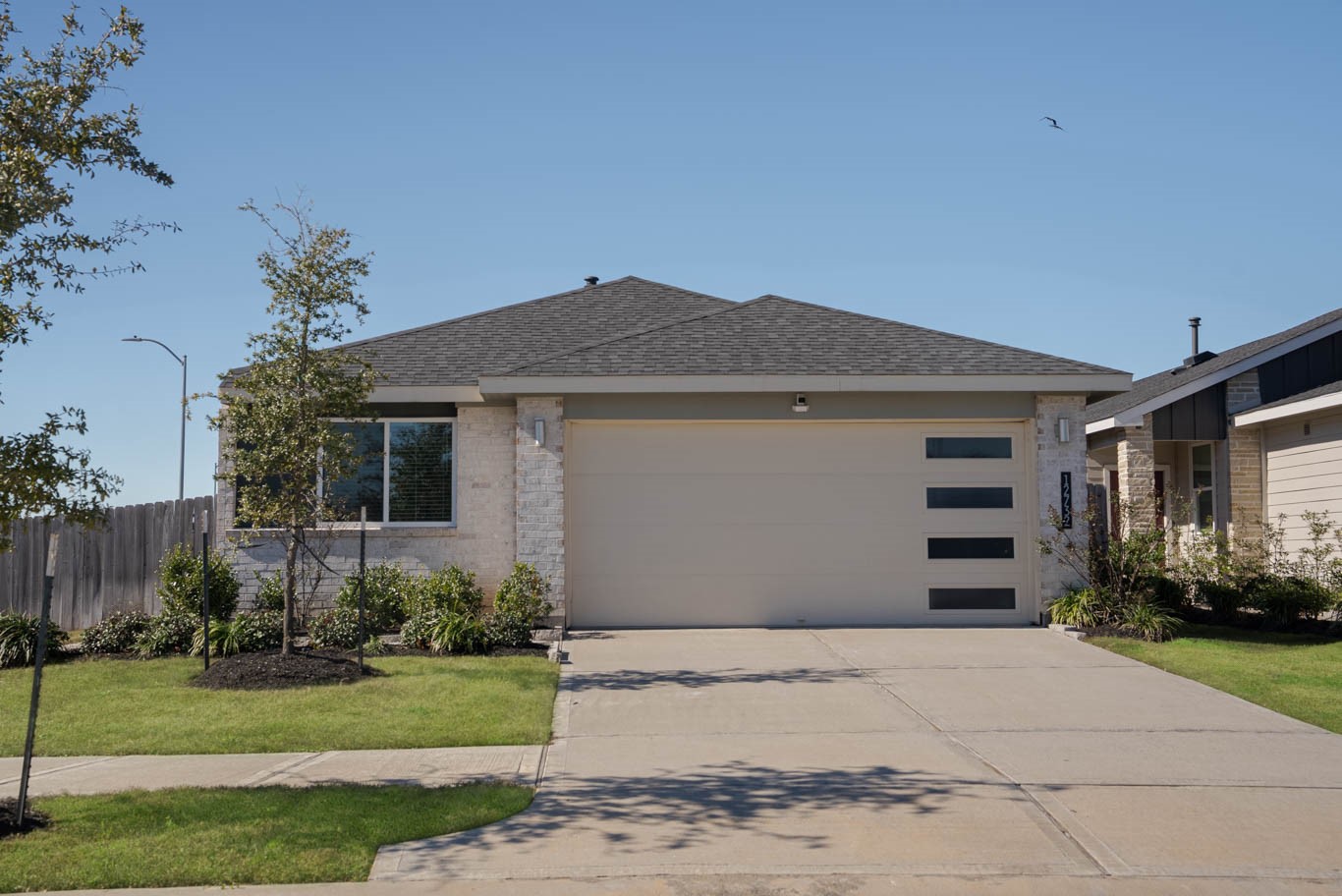 12732 Basinghall Lane Houston, TX 77047 - Photo 1 of 20 a front view of a house with a garden
