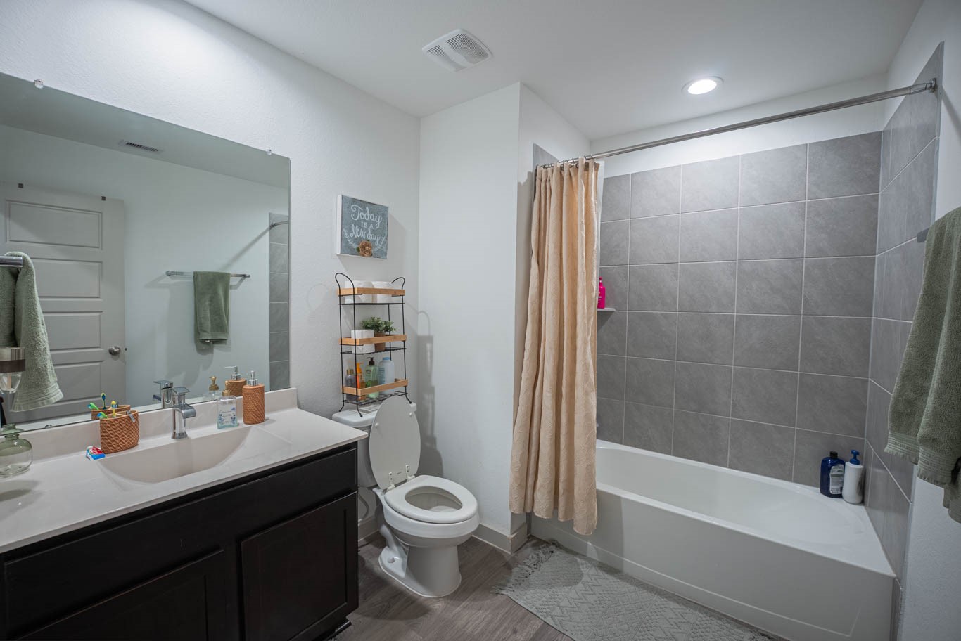 12732 Basinghall Lane Houston, TX 77047 - Photo 16 of 20 a bathroom with a bathtub shower sink vanity mirror and toilet