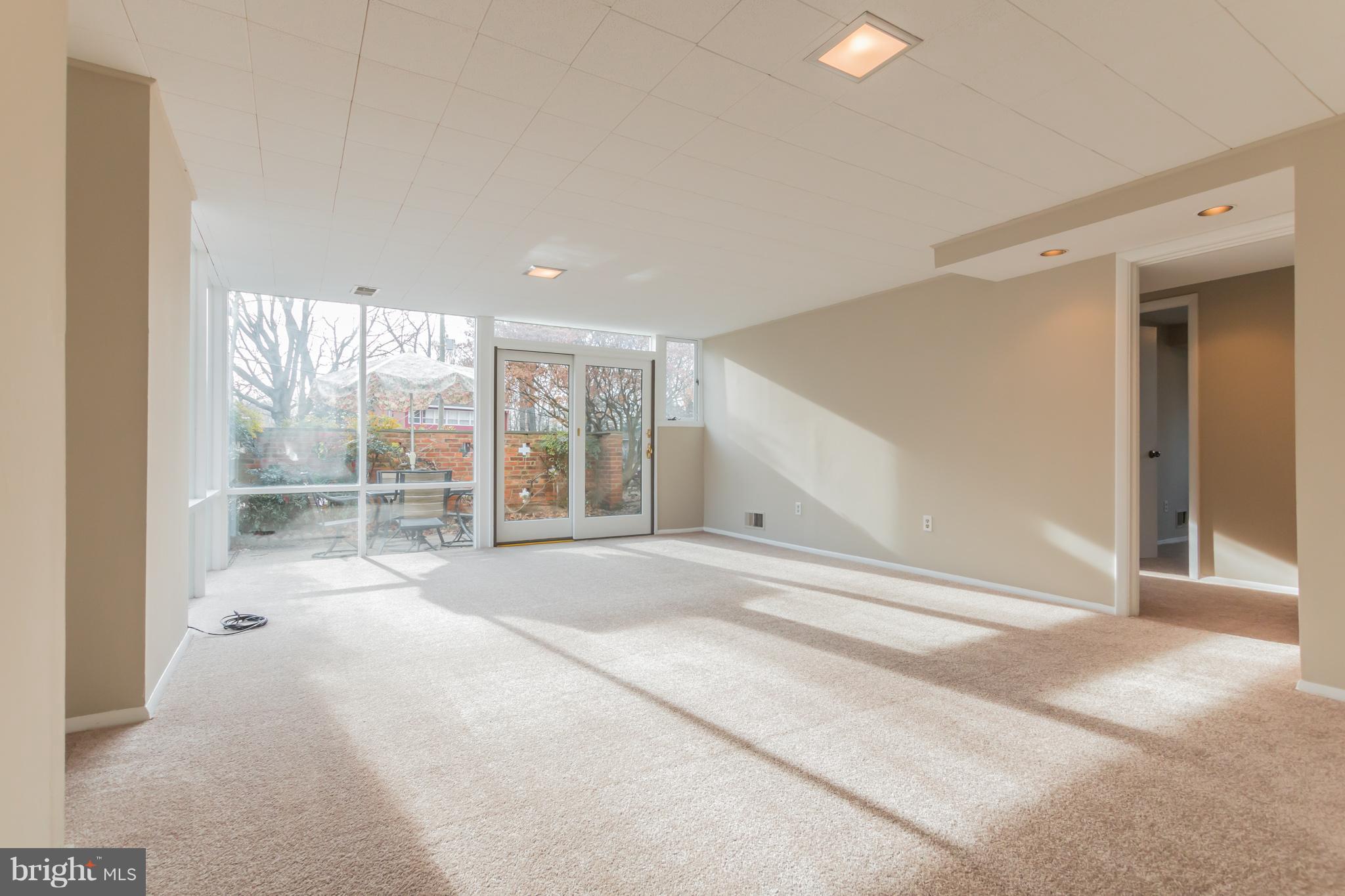 1100 La Grande Road Silver Spring, MD 20903 - Photo 23 of 30 Family room lower level showing hall to bedrooms