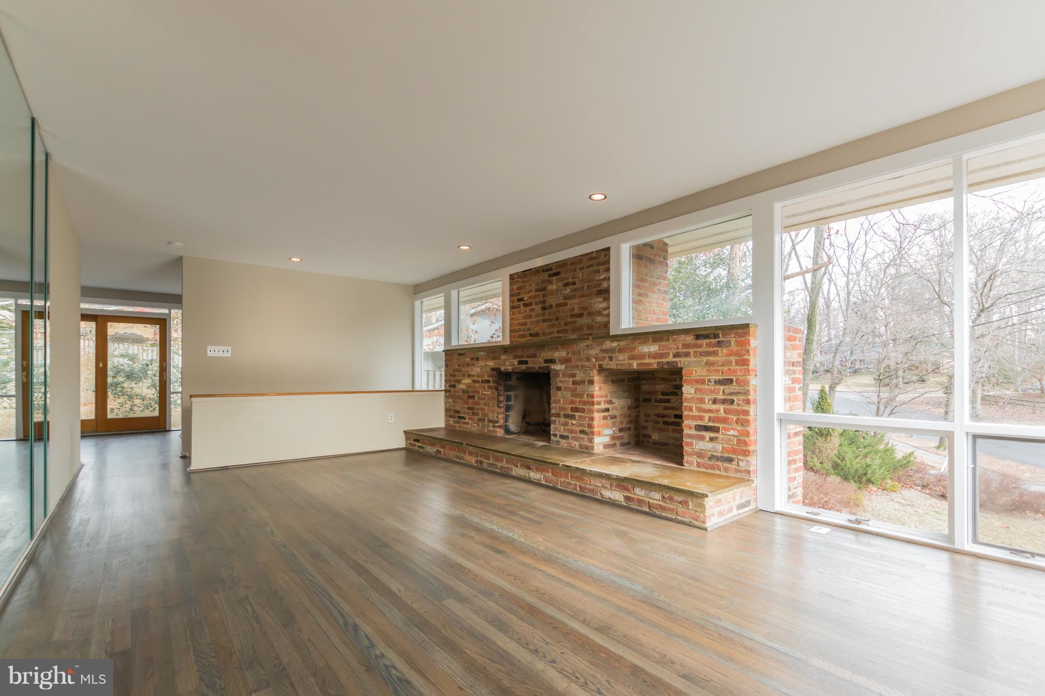 1100 La Grande Road Silver Spring, MD 20903 - Photo 4 of 30 Family room upper level, with brick surround FP