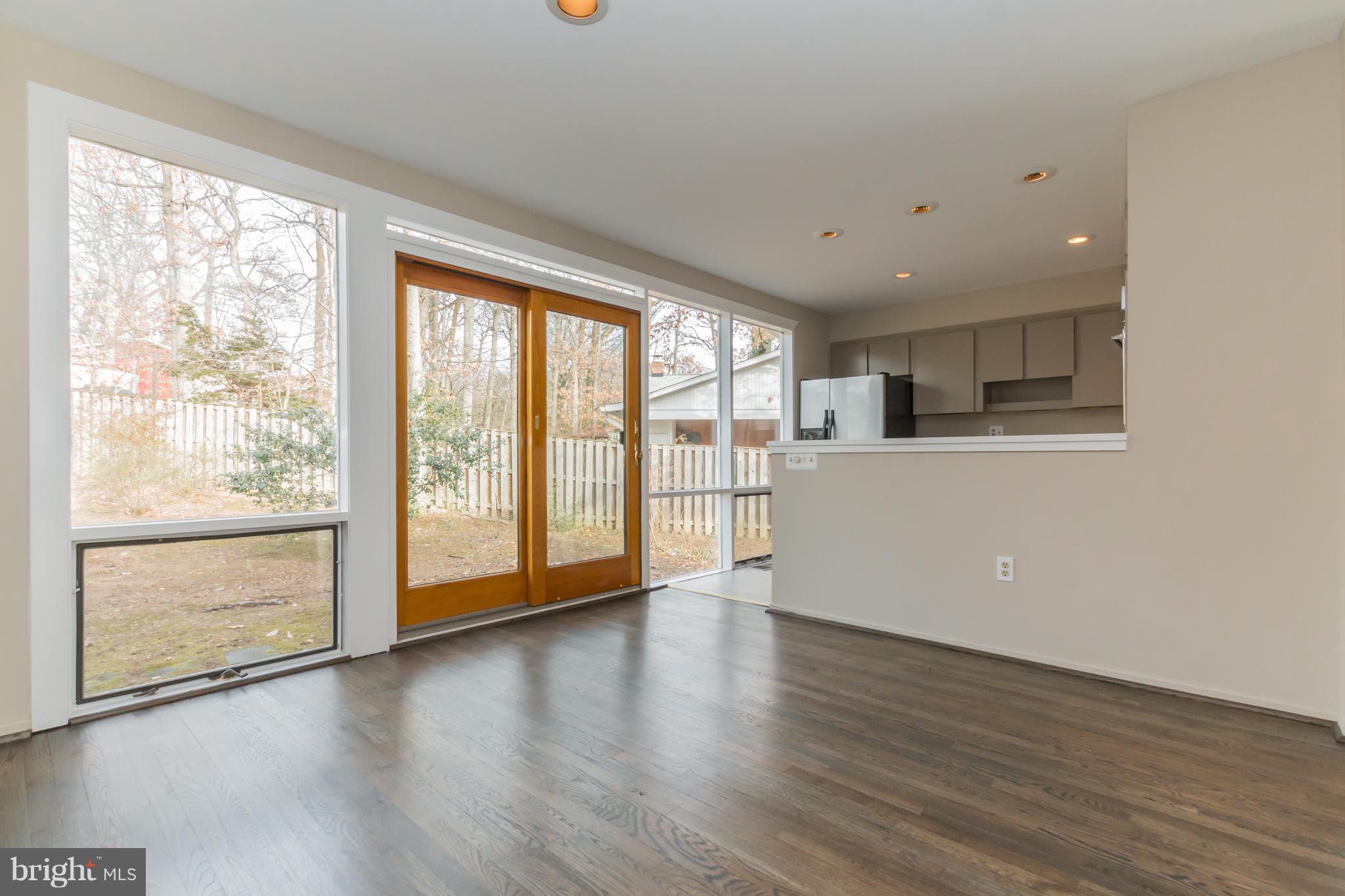 1100 La Grande Road Silver Spring, MD 20903 - Photo 8 of 30 Dining room showing windows and door to backyard