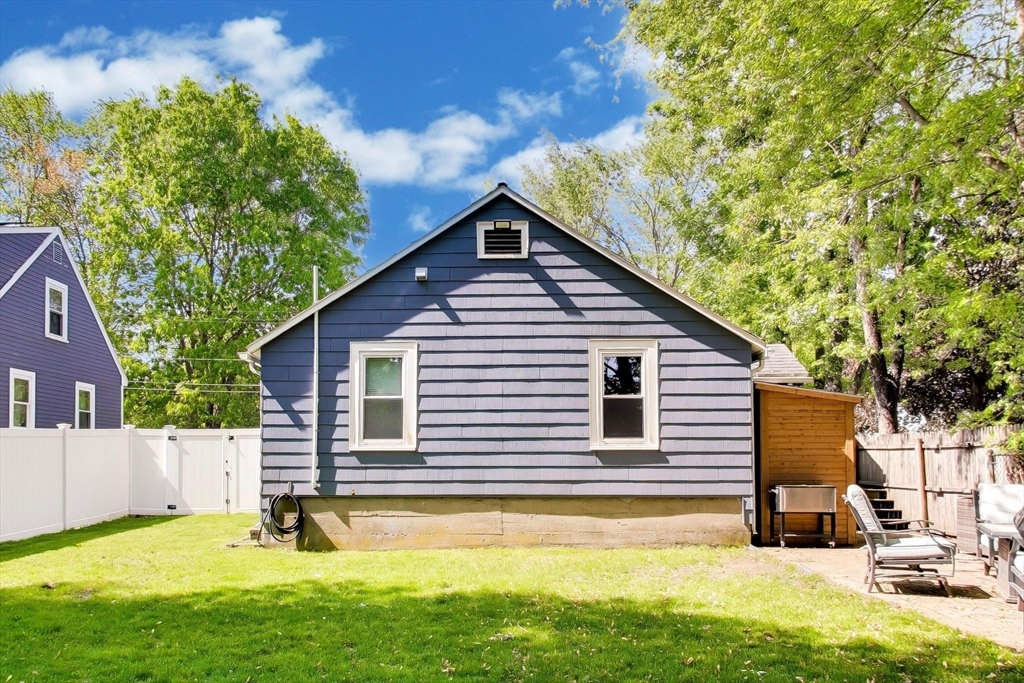 22 Douglas Road Ashland, MA 01721 - Photo 21 of 24 a backyard of a house with table and chairs