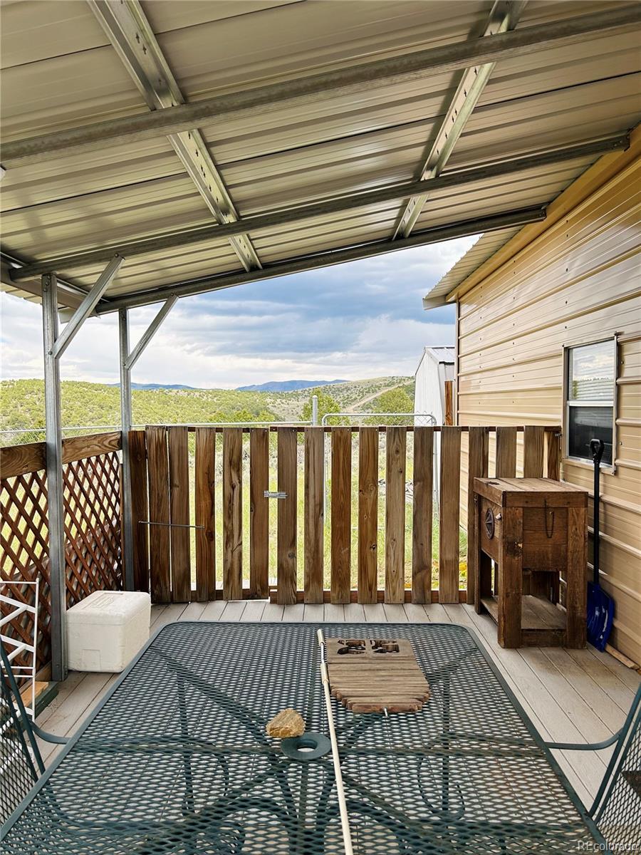 4535 Sarnoff Road Fort Garland, CO 81133 - Photo 19 of 44 a view of a porch with furniture