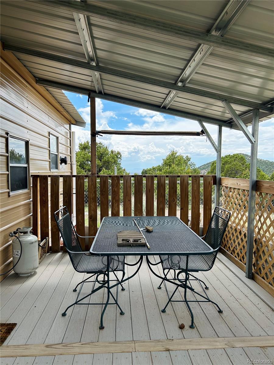 4535 Sarnoff Road Fort Garland, CO 81133 - Photo 20 of 44 a view of a chairs and table in the patio