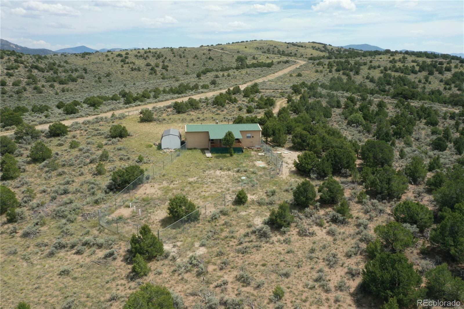 4535 Sarnoff Road Fort Garland, CO 81133 - Photo 2 of 44 a view of a forest with trees in the background