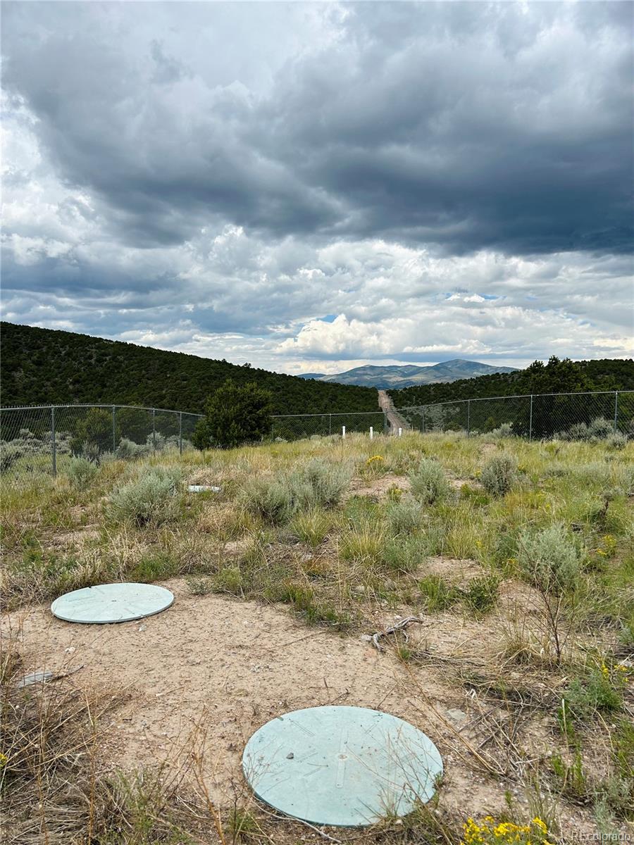 4535 Sarnoff Road Fort Garland, CO 81133 - Photo 23 of 44 a view of a swimming pool with an outdoor seating and hardwood