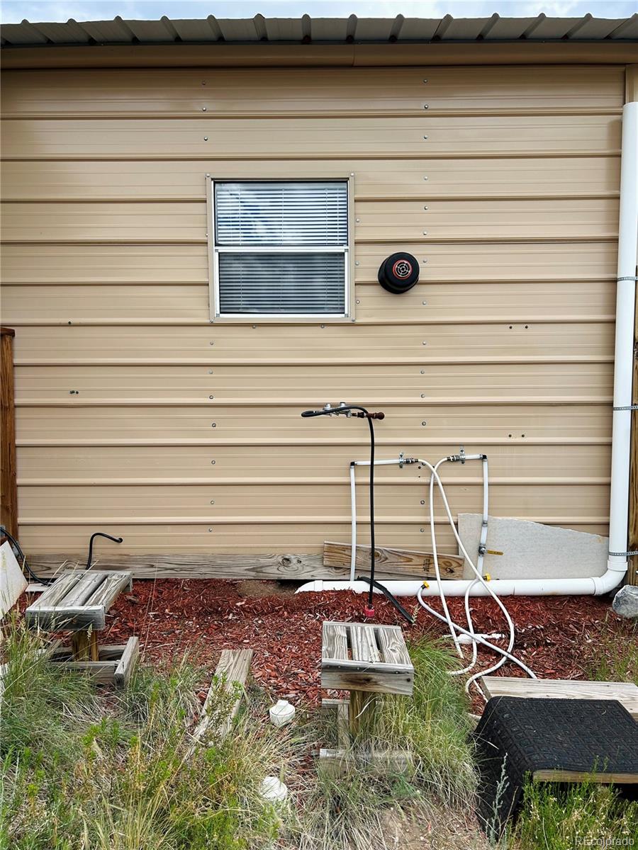 4535 Sarnoff Road Fort Garland, CO 81133 - Photo 24 of 44 a view of a bench in patio